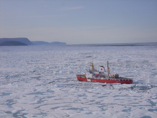 CCGS Henry Larsen in thick and multi-year ice of Nares Strait in August 2009. View is to the south with Greenland in the background. [Photo Credit: Dr. Helen Johnson]