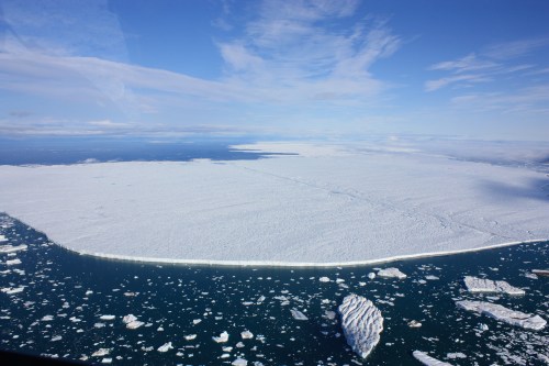 Petermann Ice Island of 2012 at the entrance of Petermann Fjord. The view is to the north-west with Ellesmere Island, Canada in the background. [Photo Credit: Jonathan Poole, CCGS Henry Larsen]