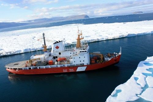 CCGS Henry Larsen at the entrance to Petermann Fjord in August 2012 adjacent to the 2012 Petermann Ice Island. [Photo Credit: Jon Poole and Canadian Coast Guard Ship Henry Larsen]