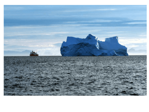 USCGC Healy in northern Baffin Bay in July 2003 with iceberg. Ellesmere Island is in the background.