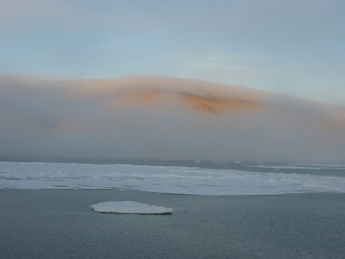 Northern Kennedy Channel near the entrance to Petermann Fjord with Kap Morton in cloud banks. [Credit: Andreas Muenchow]
