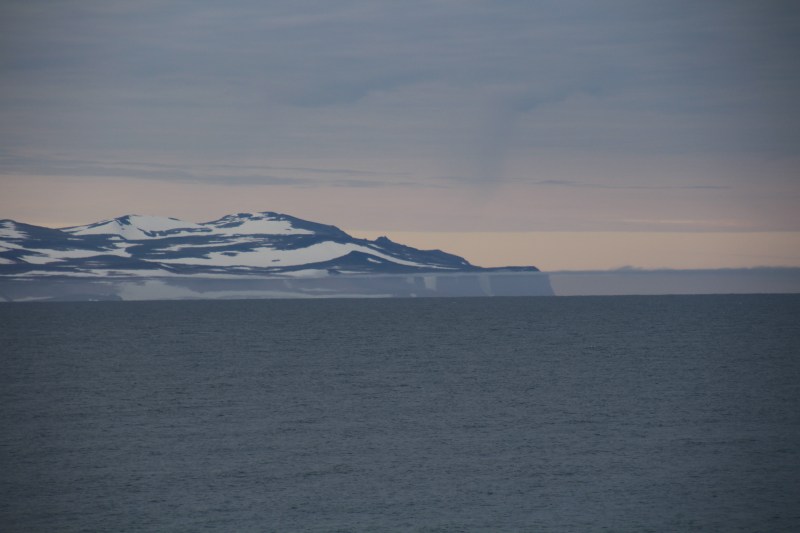 Marine layer near Kap Toby at the northern entrance of Scoresby Sund in the evening of Aug. 20, 2018. [Photo by Dragonfly Leathrum]