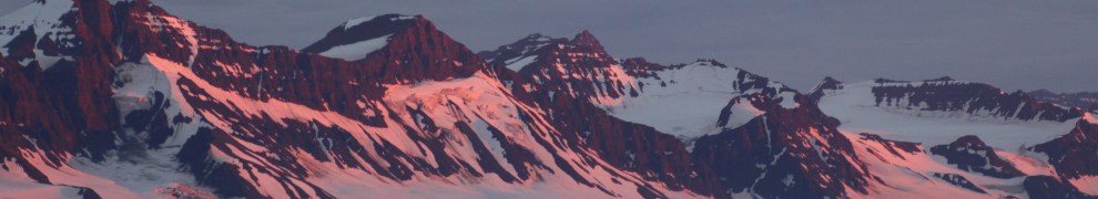 Evening sun on mountains on the Volquart Boons Kyst in Scoresby Sund on August 20, 2018. [Photo by Dragonfly Leathrum]